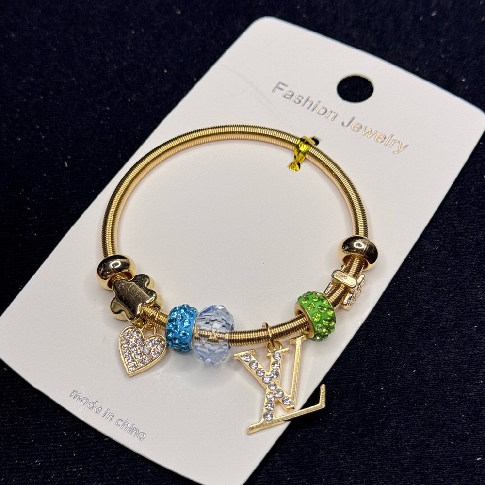 Fashion Jewelry Gold Tone Sparkling Heart
Charm Stretch Bracelet Blue Green
